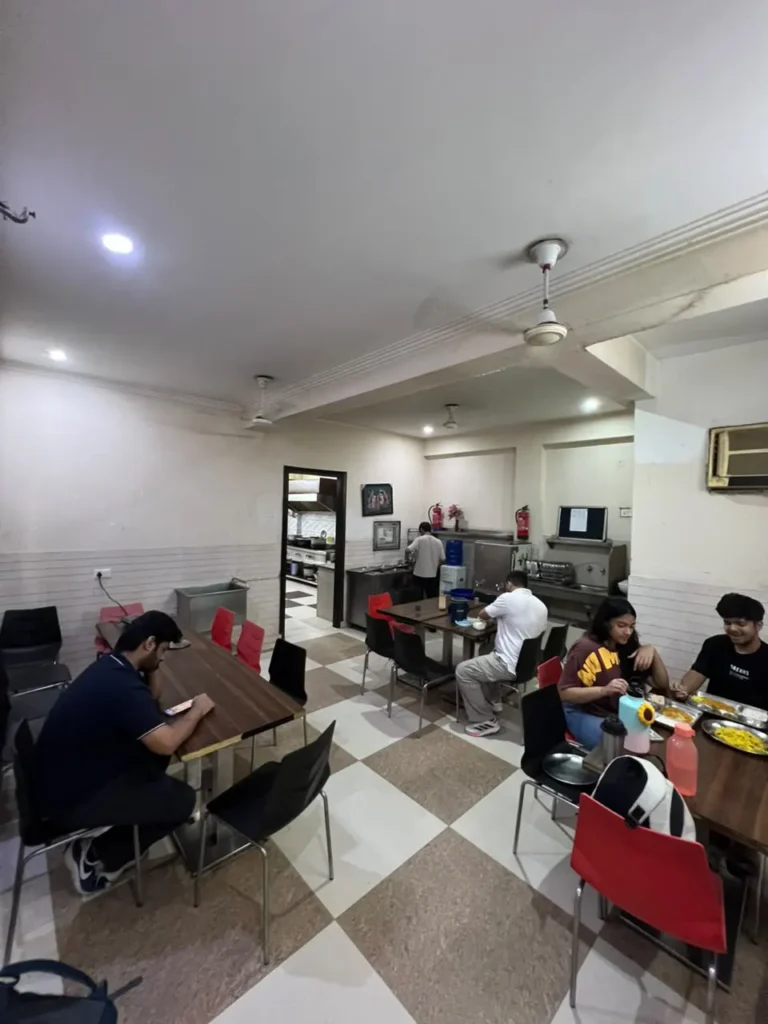 student eating in mess